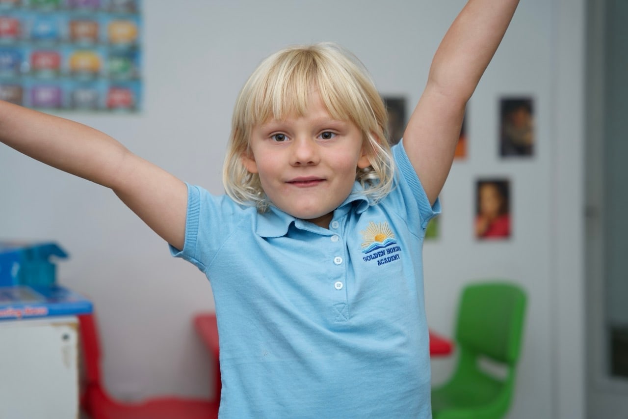A parent and child smiling together